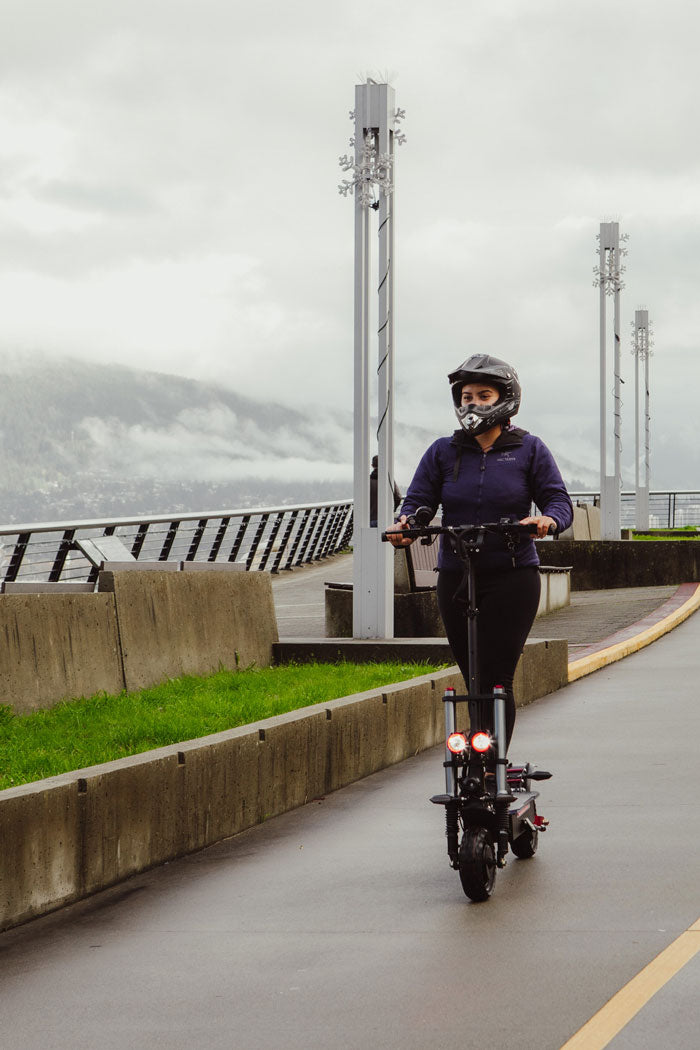 woman riding e-scooter